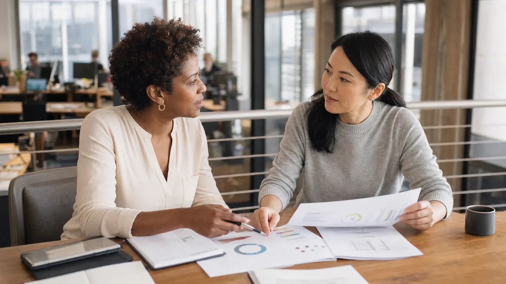 Founder and key executive reviewing a long-term benefits proposal together